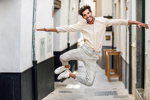 A man playfully jumping in the air